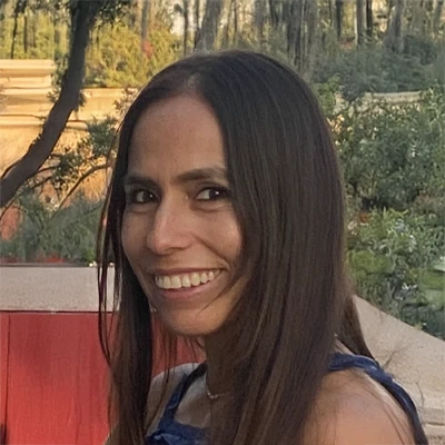 Pam smiles warmly at site users